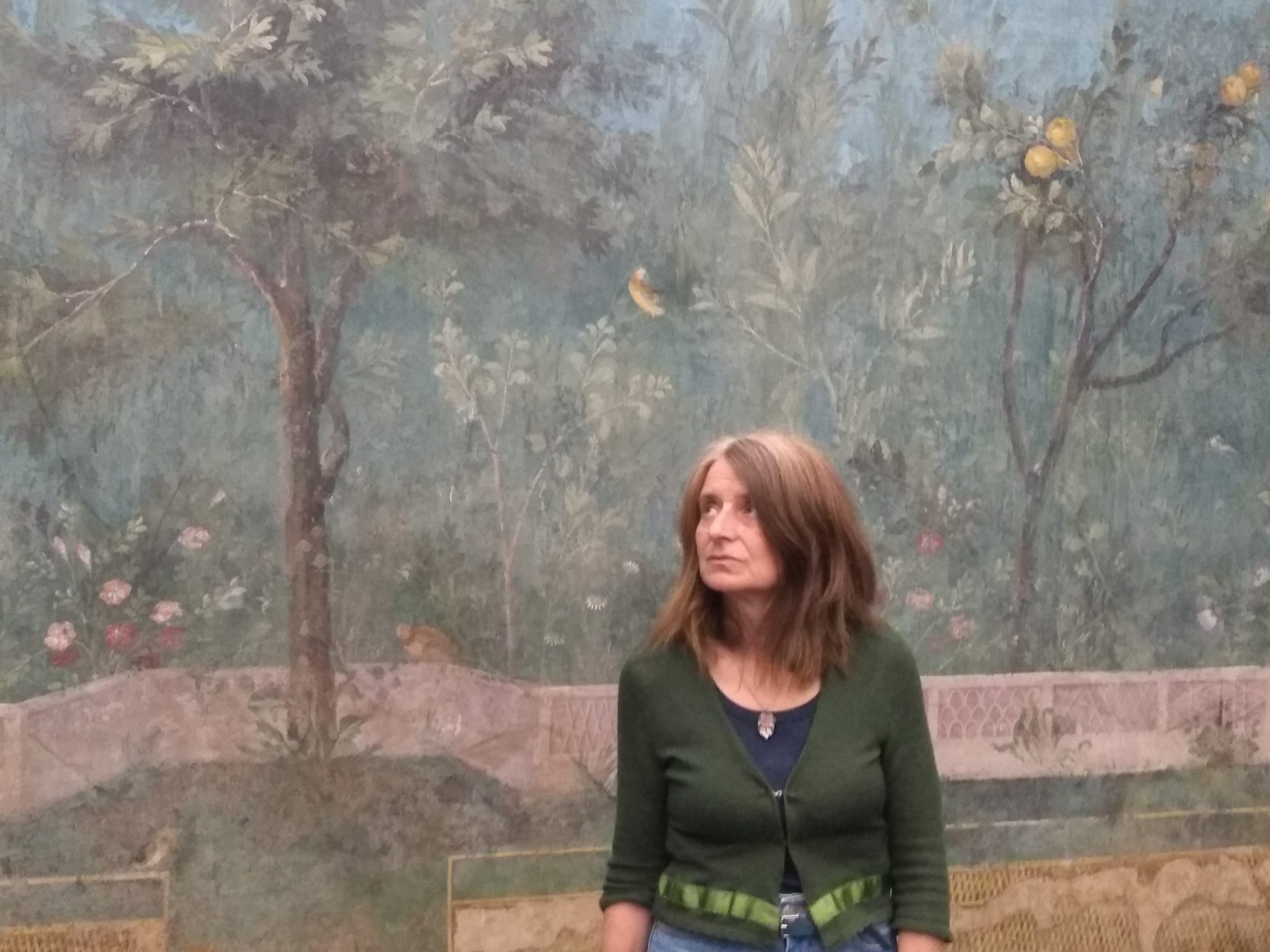 QEST study visit, Olivia Irvine in the room with the garden of Livia fresco