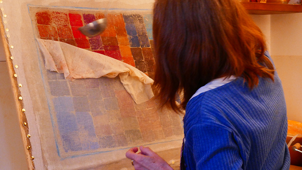Revealing a fresco by removing the calico layer