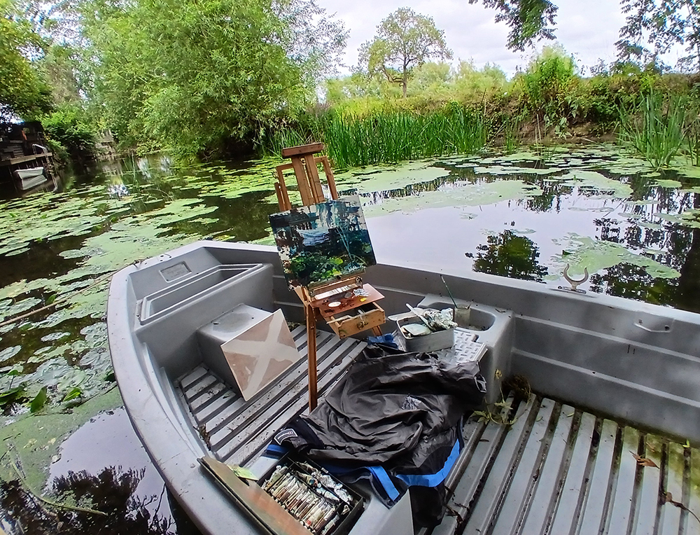 A painting on an easel in a boat
