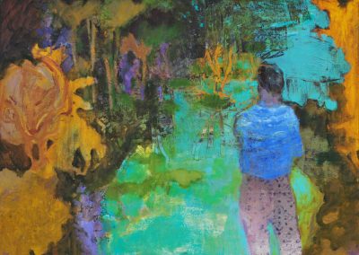 A man is standing looking at a river